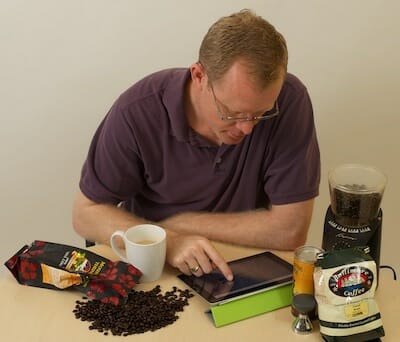 Ken with his coffee and iPad